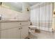 Simple bathroom with shower/tub combo and light wood vanity at 6225 Emerson Dr, New Port Richey, FL 34653