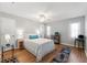Cozy bedroom with double bed, wood floors, and ceiling fan at 6225 Emerson Dr, New Port Richey, FL 34653