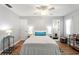 Main bedroom with double bed and en-suite bathroom access at 6225 Emerson Dr, New Port Richey, FL 34653