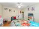 Bedroom with double bed, ceiling fan, and coastal decor at 6225 Emerson Dr, New Port Richey, FL 34653