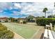 Community pool with covered seating and shuffleboard courts at 6225 Emerson Dr, New Port Richey, FL 34653