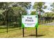 The Pines 55+ deed restricted community sign at 6225 Emerson Dr, New Port Richey, FL 34653