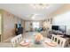Bright dining area with table set for two, adjacent to living room at 6225 Emerson Dr, New Port Richey, FL 34653