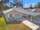 Single-story home with carport and landscaped yard at 6225 Emerson Dr, New Port Richey, FL 34653
