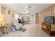 Bright living room, tiled floors, open to kitchen at 6225 Emerson Dr, New Port Richey, FL 34653