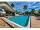 Inviting community pool with covered seating area at 6225 Emerson Dr, New Port Richey, FL 34653