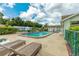 Relaxing community pool area with lounge chairs at 6225 Emerson Dr, New Port Richey, FL 34653