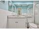 Bathroom with a granite countertop vanity, toilet, and gray tile flooring at 6520 Pine Meadows Dr, Spring Hill, FL 34606