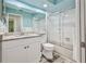 Bathroom featuring a shower with sliding glass doors, granite countertop, and white tiled walls at 6520 Pine Meadows Dr, Spring Hill, FL 34606
