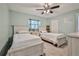 Charming bedroom featuring two twin beds and tasteful decor at 6520 Pine Meadows Dr, Spring Hill, FL 34606
