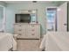 Bright bedroom with a TV and an en-suite bathroom at 6520 Pine Meadows Dr, Spring Hill, FL 34606