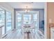 Charming breakfast nook overlooking the pool with ample sunlight and comfortable seating at 6520 Pine Meadows Dr, Spring Hill, FL 34606