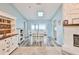 Dining room with plenty of natural light and view of the stone fireplace at 6520 Pine Meadows Dr, Spring Hill, FL 34606