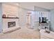 Open floor plan with stone fireplace, view to entryway, and seamless flow to dining area at 6520 Pine Meadows Dr, Spring Hill, FL 34606