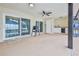 Spacious covered patio features a ceiling fan and convenient outdoor sink with prep area at 6520 Pine Meadows Dr, Spring Hill, FL 34606