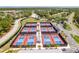 Aerial image showcasing multiple, well-maintained pickleball courts within a vibrant community setting at 6520 Pine Meadows Dr, Spring Hill, FL 34606