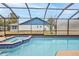 View of the screened-in pool with a jacuzzi-style add-on at 6520 Pine Meadows Dr, Spring Hill, FL 34606