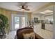 Kitchen with granite countertops, stainless steel appliances, and views to backyard at 6528 Louise Ct, Hudson, FL 34667