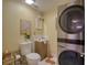 Laundry room with stackable washer and dryer at 6528 Louise Ct, Hudson, FL 34667