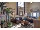 Living room with leather sofas, high ceilings, and fireplace at 6528 Louise Ct, Hudson, FL 34667