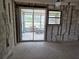 Under renovation kitchen with view to enclosed patio at 6612 Sierra Ter, New Port Richey, FL 34652