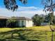 Landscaped backyard with shed and fenced area at 7240 Dogleg Ct, Port Richey, FL 34668