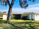 Large backyard with mature trees and landscaping at 7240 Dogleg Ct, Port Richey, FL 34668