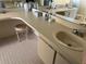 Double vanity bathroom with a large countertop and storage at 7240 Dogleg Ct, Port Richey, FL 34668