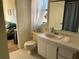 Clean bathroom with single vanity and shower/tub combo at 7240 Dogleg Ct, Port Richey, FL 34668