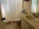 Bathroom with toilet, sink, and shower at 7240 Dogleg Ct, Port Richey, FL 34668