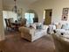 Open concept dining area with wood table and seating for six at 7240 Dogleg Ct, Port Richey, FL 34668