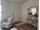 Bright living room with comfortable seating and a decorative mirror at 7240 Dogleg Ct, Port Richey, FL 34668