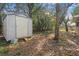 Large backyard with a shed and mature trees at 7464 Acorn Cir, Spring Hill, FL 34606