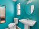 Clean bathroom with pedestal sink and toilet at 7464 Acorn Cir, Spring Hill, FL 34606