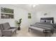 Charming bedroom with a king-size bed, gray color scheme, and plenty of natural light at 7464 Acorn Cir, Spring Hill, FL 34606