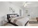 Spacious bedroom with a king-size bed, modern decor, and ample natural light at 7464 Acorn Cir, Spring Hill, FL 34606