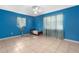 Cozy bedroom with a twin bed, blue walls, and a tranquil feel at 7464 Acorn Cir, Spring Hill, FL 34606