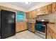 Galley style kitchen with stainless steel appliances at 7464 Acorn Cir, Spring Hill, FL 34606