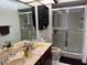 Bathroom with double vanity and shower/tub combo at 7635 Bloomingdale Dr, New Port Richey, FL 34654