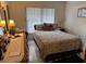 Cozy bedroom with double bed and ensuite vanity at 7635 Bloomingdale Dr, New Port Richey, FL 34654
