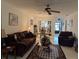 Living room with comfy seating, view of dining area and patio at 7635 Bloomingdale Dr, New Port Richey, FL 34654