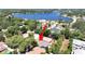Aerial view of property highlighting its position near the lake at 807 Virginia Ave, Tarpon Springs, FL 34689