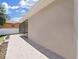 Back patio with light-colored tile flooring and screened enclosure at 807 Virginia Ave, Tarpon Springs, FL 34689