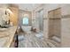 Large bathroom with double vanity, soaking tub and walk-in shower at 807 Virginia Ave, Tarpon Springs, FL 34689