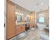Spa-like bathroom featuring double sinks, large soaking tub, and ample storage at 807 Virginia Ave, Tarpon Springs, FL 34689