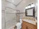 Clean bathroom with a large shower and granite vanity at 807 Virginia Ave, Tarpon Springs, FL 34689
