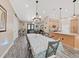 Spacious dining area with hardwood floors, large table, and access to kitchen at 807 Virginia Ave, Tarpon Springs, FL 34689