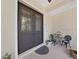 Elegant entryway with double doors and a small sitting area at 807 Virginia Ave, Tarpon Springs, FL 34689