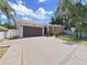 House exterior with two-car garage and driveway at 807 Virginia Ave, Tarpon Springs, FL 34689