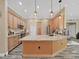 Large kitchen island with granite countertops and stainless steel appliances at 807 Virginia Ave, Tarpon Springs, FL 34689